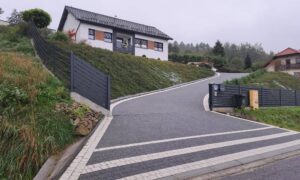 Shared access driveway gate property road question - ALTA SURVEY Minnesota Shared access driveway with a gate and fencing, showing why a due diligence survey helps confirm legal road rights before buying