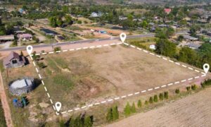Aerial view of a property showing defined lot boundaries where a lot survey helps clarify zoning and land use