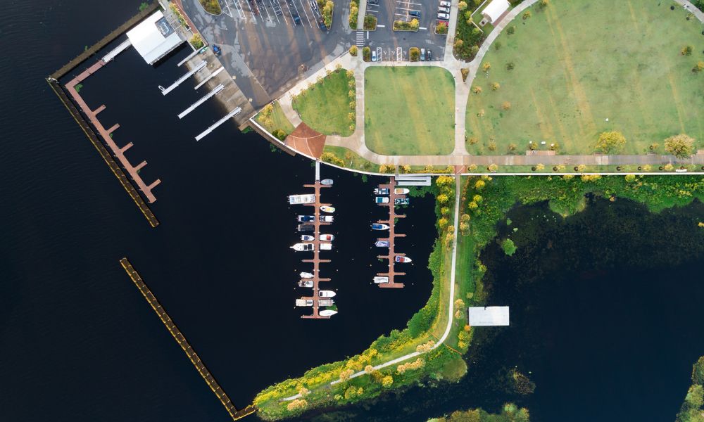 Lakefront cabin with a dock, shoreline, and surrounding property features relevant to a property survey before closing